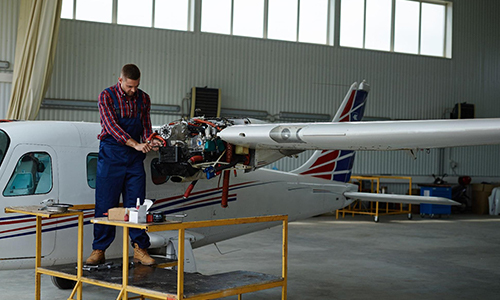 Man working on helicopter